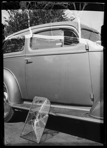Chevrolet sedan, showing damage to door and glass, Southern California, 1936
