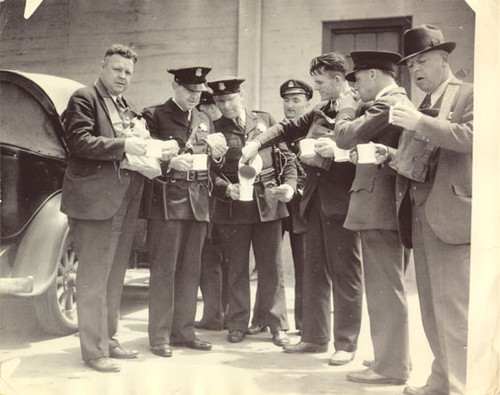 [Police officers and reporters taking break during strike of 1934]