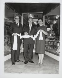 Cutting diapers at opening of Don Weiss Baby News Store, Santa Rosa, California, 1963
