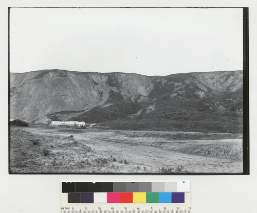 [Horses and tents at base of eroded hill. [Compare to Plate 12B of report: along rift between Mussel Rock and San Andreas Lake?]