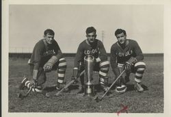 Hal Daly, Aldarico "Babe" Agamenoni, and Dominic Nocerine with trophies