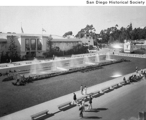 People walking past the Firestone Fountain during the 1935 Exposition
