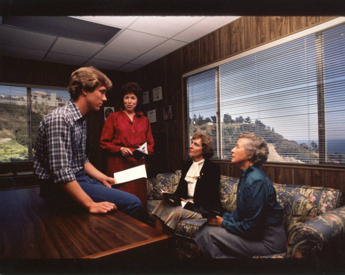 Student accepting scholarship from Associated Women of Pepperdine, mid 1980s