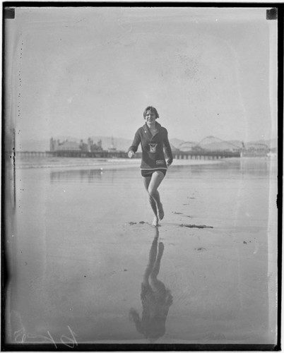 Lily May Bowmer jogging on the beach near Santa Monica Pier, California