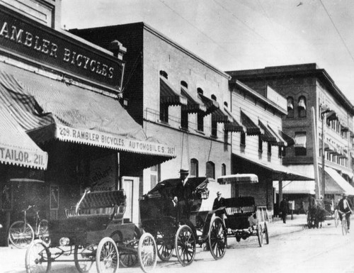 Cars in front of bicycle store