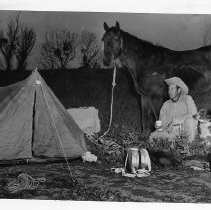 (Bernhardt) Bob Kleeman of Sacramento (an attorney), who is traveling the Oregon Trail by horseback, with his horse Big Brill and his dog Beauregard, at his first encampment on the East Bank of the Yolo Bypass