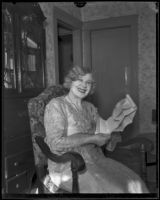 Minnie Kennedy, mother of Aimee Semple McPherson, with documents in her hands, Los Angeles, 1920-1939