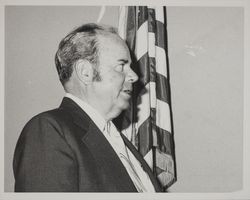 Portrait of an unidentified, male, county official taking an oath