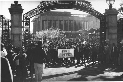 Group carrying "Free Speech" banner through Sather Gate [ca. 1965]