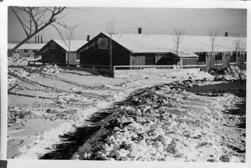 Road leading to barracks covered with snow at Granada Relocation Center