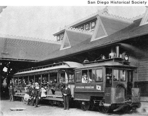 Passengers riding in a railroad car from the Pacific Coast Steamship Company wharf