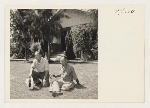 Teruo Tanaka, left, and Utaro Nakada, right, seated on the lawn of the Nakada home at Rt. 2, Box 7