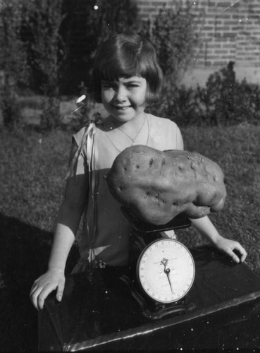 Girl with potato