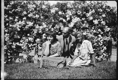 Pearl Hinds Roberts, Frederick Madison Roberts and unidentified woman sitting on lawn