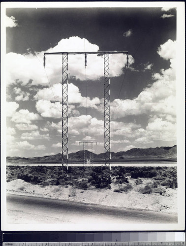 View down H-frame transmission line corridor built by Southern Sierras Power Co. to serve the construction of Hoover Dam
