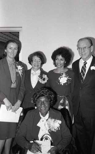 Kitty White posing with others at the A.C. Bilbrew Library, Los Angeles, 1983