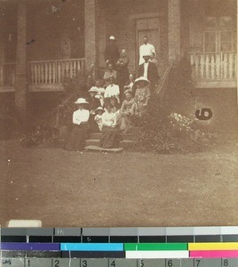 Missionaries gathered on the steps of the teacher's house, Ivory, Fianarantsoa, Madagascar, 1906-1910