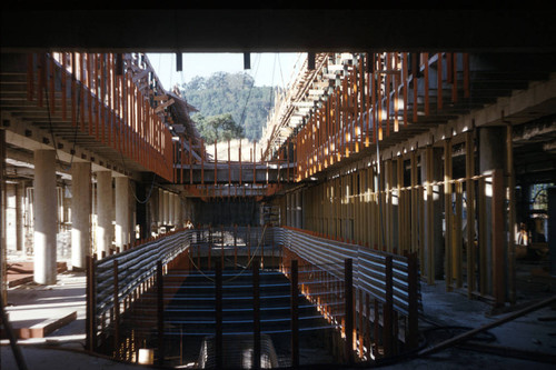 Construction and framing inside the mall of the Administration Building, part of the Frank Lloyd Wright-designed Marin County Civic Center, San Rafael, California, circa 1960 [photograph]