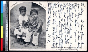 Two young children sitting on a step, India, ca.1900-1920
