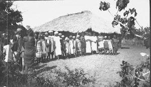 African people in front of the chapel in Macaneta, Mozambique