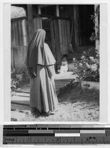 Maryknoll Sister making a house visit, Honolulu, Hawaii, 1949