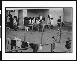 Children gathering near preacher, Dolores, Los Angeles, 1996