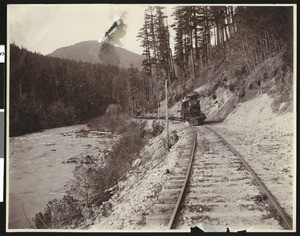 Railway train next to a river in Oregon