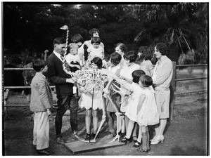 Group of children studying an ostrich skeleton in Lincoln Park