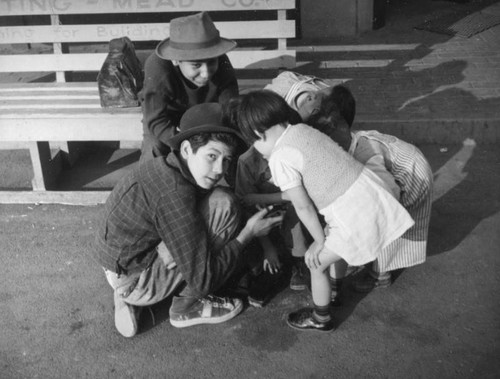 Kids kneeling in a circle
