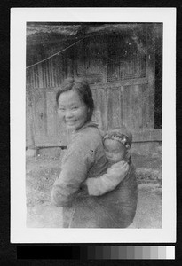 Young mother with baby, Sichuan, China, ca.1900-1920