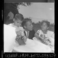 Sergeant Shriver with two children in Operation Head Start program in Pacoima, Calif., 1966