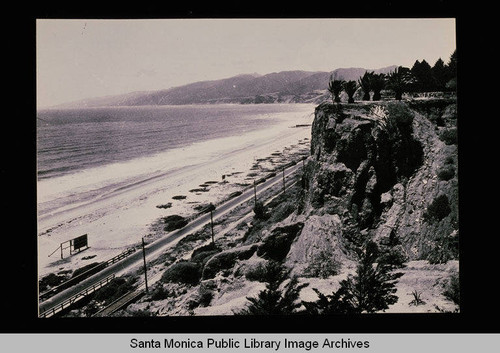 Beach from the Palisades looking north along the coast road to the Santa Monica Mountains