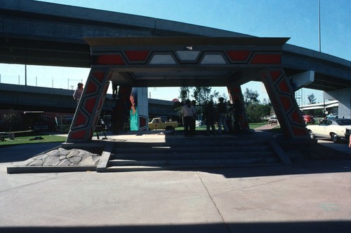 Chicano Park: Kiosko: general view of gazebo with mural artists gathered underneath