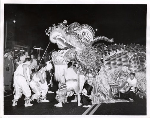 [Dragon slithering through a crowd in Chinatown]