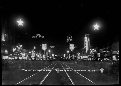 "Santa Claus Lane" at night, Hollywood Blvd, Hollywood, Cal