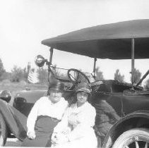 Two women and an automobile
