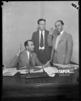 Judge Irvin Taplin, Deputy District Attorney Harry Hunt, and County Clerk L.E. Lampton, at Taplin's desk, [1929?]