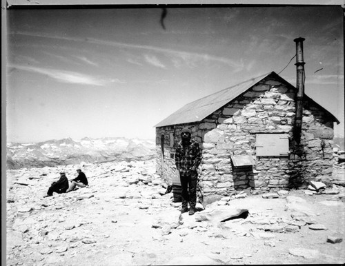 Backcountry Cabins and Structures, NPS Individuals, Larry L. Norris on summit of Mount Whitney by Whitney Hut. Elevation 14,492