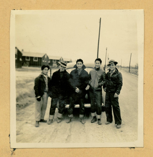 Group of Nisei men with a car at Jerome camp