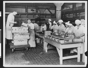 Wilson & Company's workers packing sausage, ca.1930