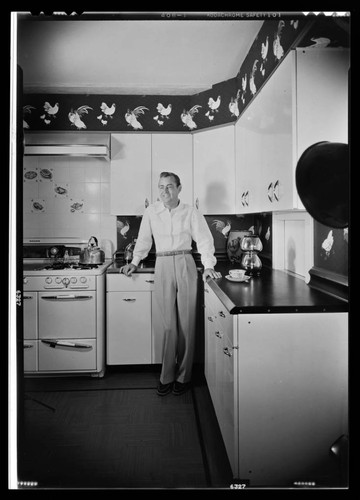 Ladd, Alan, residence. Alan Ladd in kitchen