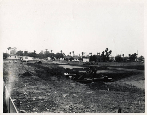 Construction of the Santa Monica Municipal Pool at the start of excavation with shovel in diving pool section, June 14, 1950