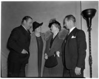 Actor Edmund Burns and his wife in conversation with Dutch hotelier Axel Springborg and his wife, Los Angeles