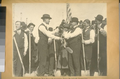 Supervisor Paul Bancroft, Charman [sic] Public Buildings Committee presenting Mayor Rolph with a Silver Shovel at ground breaking exercises. City hall site. April 5, 1913, at 3 o'clock p.m