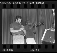 Ruben Leon and trumpet player performing in Black and Brown Brotherhood Band, Los Angeles, Calif., 1979