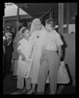 Mother Ruth, widow of Krishna Venta, reunites with two of her daughters at Los Angeles International Airport, 1958