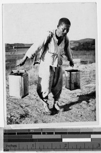Man carrying water, Peng Yang, Korea, ca. 1920-1940