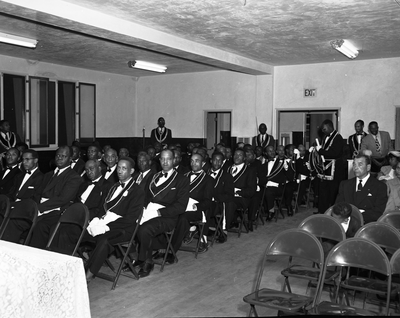 Masons seated in meeting hall