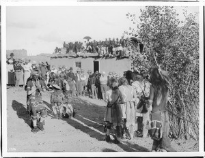 Beginning of the snake dance in the Hopi Snake Dance Ceremony with onlookers, Oraibi, Arizona, ca.1898