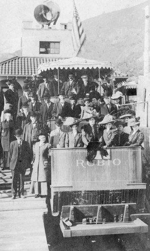 Group poses on Rubio Incline car